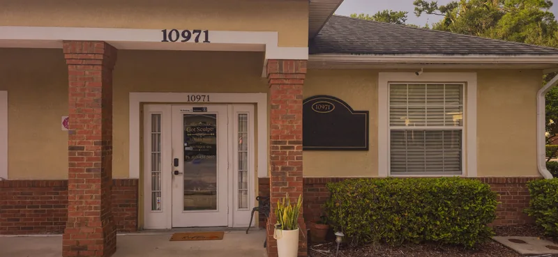 The front door of the 10971 Countryway Blvd building, with the building number above it